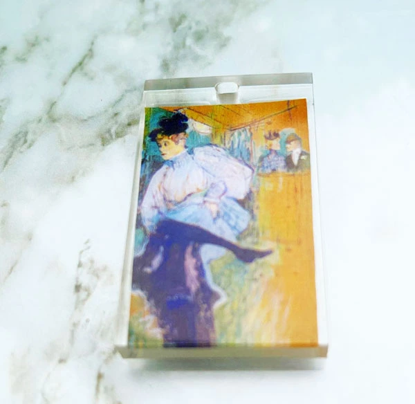 Toulouse Lautrec painting encased in small resin charm