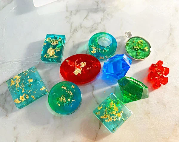 Assortment of multicoloured resin pieces in different shapes