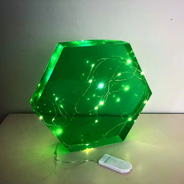 fairy lights encased in green resin hexagon